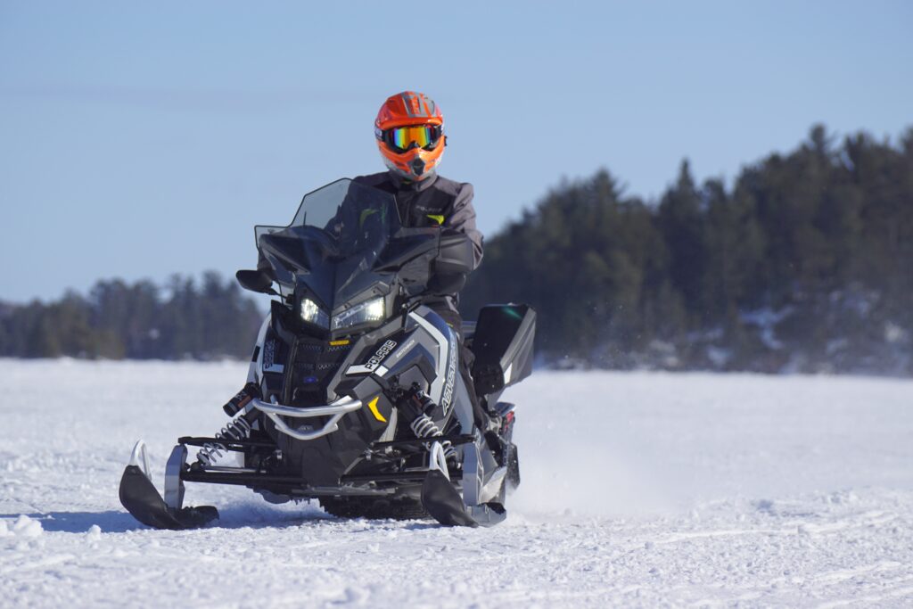 Man riding snowmobile